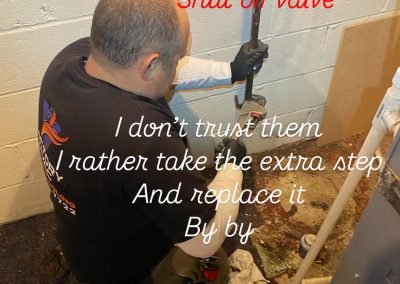 A plumber kneels by a wall, replacing a shut-off valve with tools near exposed pipes. Text overlays the image.