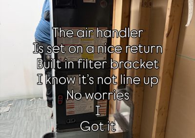 An air handler unit is installed in a basement with text instructions overlaid on the image.